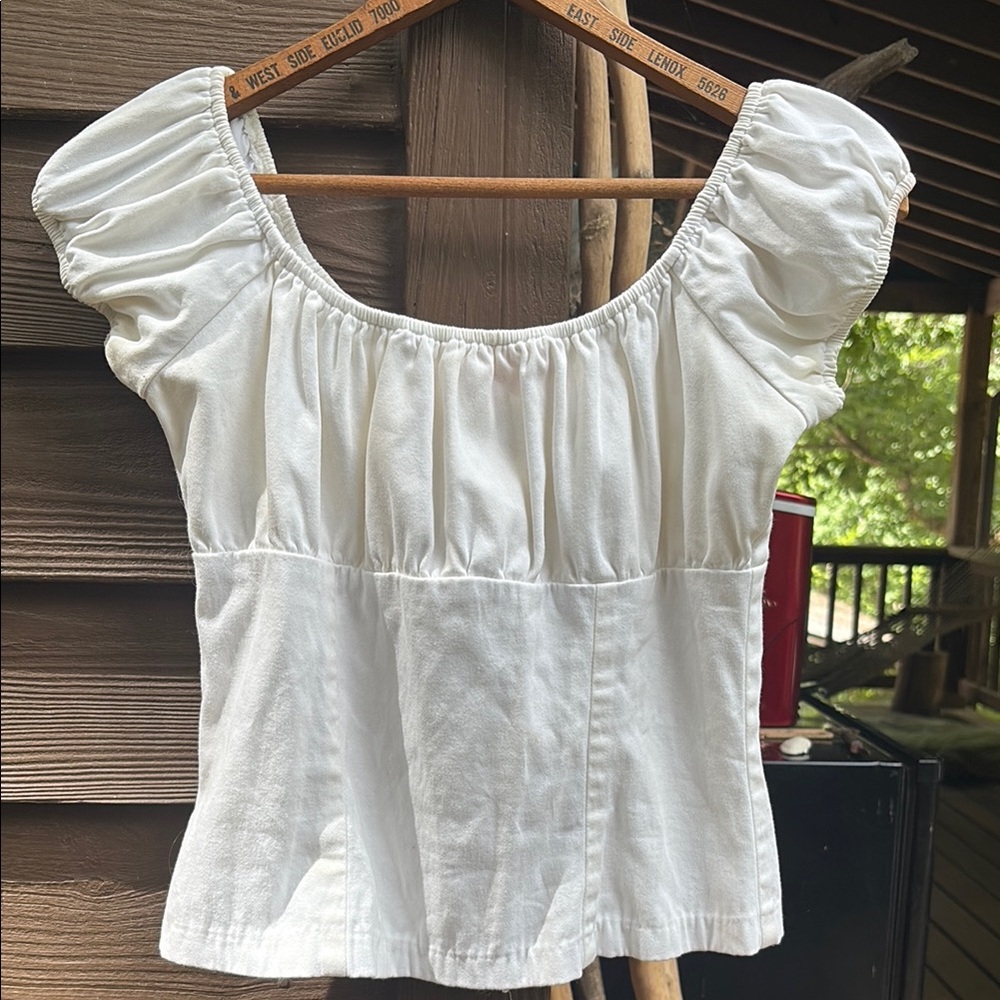 Pinup Couture White Puff Sleeve Ruffled Blouse in used condition